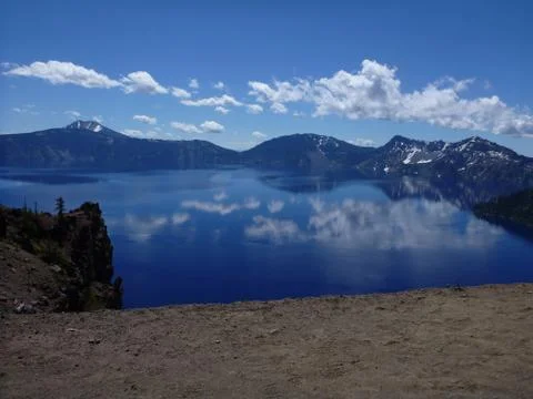 Crater with clouds and mountains Stock Photos