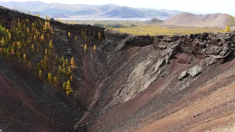 The crater of an extinct volcano against a distant lake, Mongolia. Stock Footage 234966225