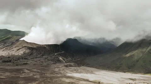 Crater of mountain Bromo volcano in Java Indonesia. Smoke eruption timelapse Stock Footage 64378961