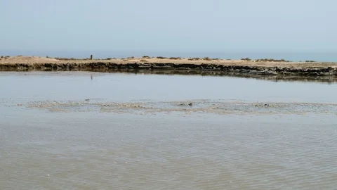 Crater of mud volcano bursting bubbles with natural gas. Famous nature landma Stock Footage 104992804
