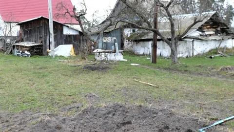 Crater from a Russian shell in the courtyard of a private house Видео 200127556