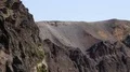 Crater of Vesuvius with solidified magma turned into sharp relief volcanic rocks HD Footage