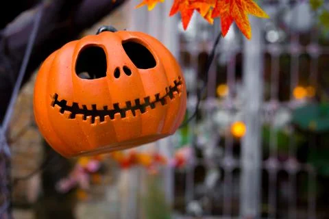 Craved pumpkin head jack lantern is decorated with scary theme in Halloween Stock Photos