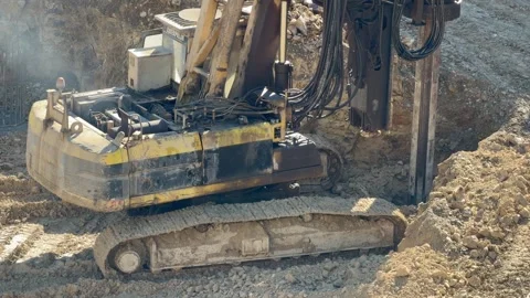 Crawler drilling rig operating at construction site. Equipment for drilling Video stock 328352329