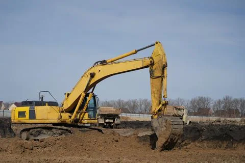 Crawler excavator digging a pit Stock Photos
