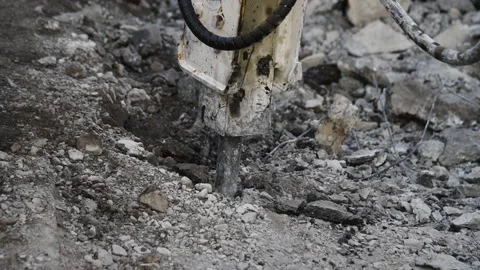 Crawler excavator with hydraulic jackhammer for breaking concrete on highway  動画素材 152077549
