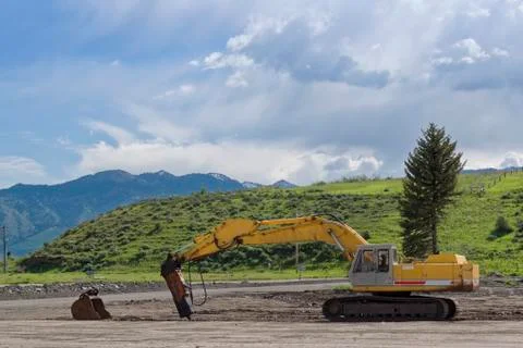 Crawler excavator performs work in a construction site Foto stock