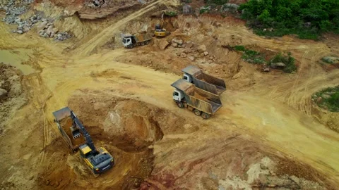 Crawler Excavators working in sand mining to fill truck with sand in telangana Stock Footage 302789032