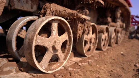 Crawler tracks of a plowing tractor and a field in early spring, a plowed field  Stock Footage 156076331