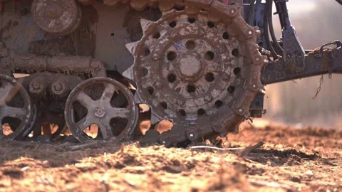 Crawler tracks of a plowing tractor and a field in early spring, a plowed field  Stock-Footage 156076357
