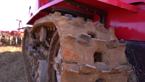 Crawler tracks of a plowing tractor and a field in early spring, a plowed field  Stock Footage 156076574