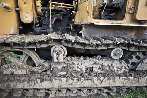 Crawler tractor covered with earth Stock Photos