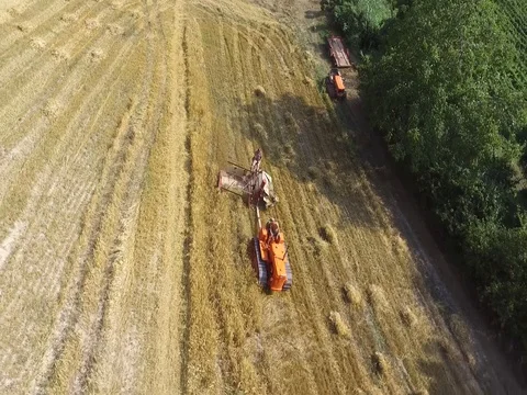 Crawler tractor with old harvester Stock Footage 75215204