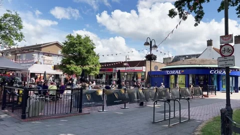 Crawley square with people drinking beer outdoors Stock Footage 280791824
