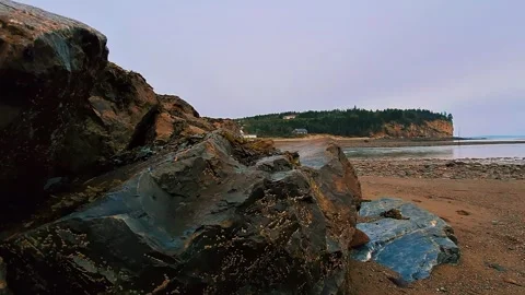 Crawling Shot Over Large Rocks Covered In Seaweed During Low Tide Atlantic Ocean Stock Footage 255335764
