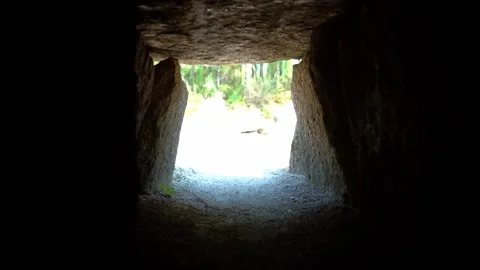 Crawling through a ancient rock tunnel - Slow Motion Stock Footage 159371206