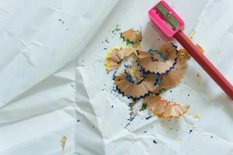 Crayons and sharpener on white background Stock Photos