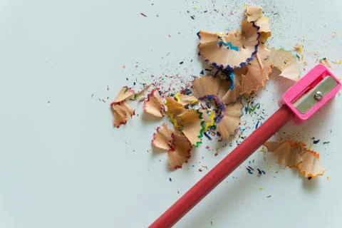 Crayons and sharpener on white background Stock Photos