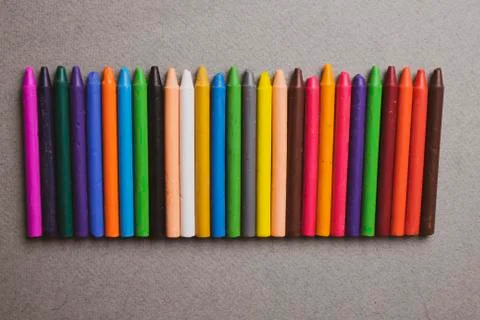 Crayons background, Colored Pencils on grey paper Stock Photos