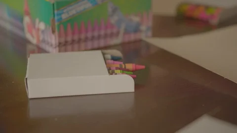 Crayons in a cardboard box Stock Footage 103823369