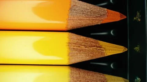 Crayons in yellow gradient row. Extreme macro shot. Pencils graphite set. Stock-Fotos