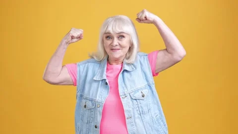 Crazy aged lady indicate triceps exercise isolated shine color background Stock Footage 189783976