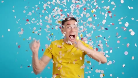 Crazy and funny man dancing as confetti falls on him Stock Footage 257296813