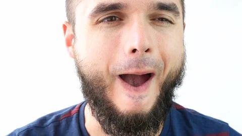 Crazy bearded man face grimacing 库存影片 75390144