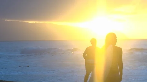 Crazy bright sunset sun flare at Banzai Pipeline Stock Footage 92691076