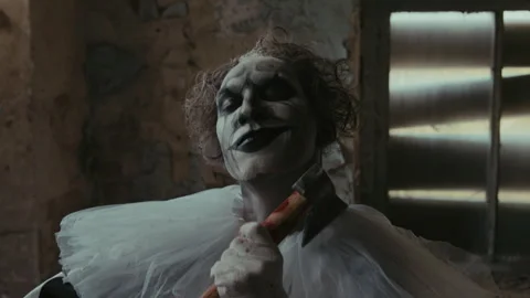 Crazy Clown with Axe Dancing in His Abandoned House Stock Footage 250941631