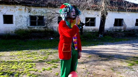 Crazy Clown with a baloon Stock Footage 117719753