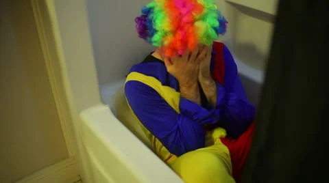 Crazy clown guy panic attack bath tub Stock Footage 62794183