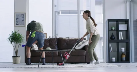 Crazy couple, vacuum cleaning and dancin... | Stock Video | Pond5
