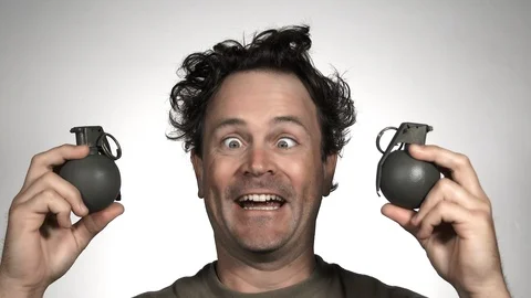 Crazy Cross Eyed Man Gets Hold Of Hand Grenades Stock Footage 117134902