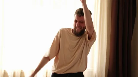 Crazy dance of a young bearded guy. Stock Footage 278798868