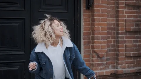 Crazy dancing and fun. Beautiful curly girl funny dancing and having fun. Stock Footage 106900764