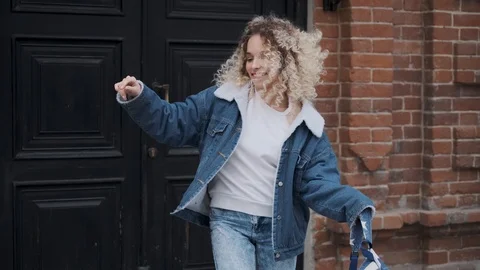 Crazy dancing and fun. Beautiful curly girl funny dancing and having fun. Stock Footage 123712091