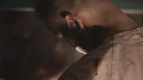 Crazy doctor prepares tools for the next victim Stock Footage 76606835