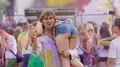 Crazy drunk man holding female friend on shoulder, slapping girls buttocks HD Footage