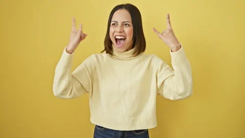 Crazy fun! beautiful young hispanic woman, rock music star concept, gesturi.. Stock Footage 273734112