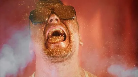 Crazy fun positive face man in gold glitter. Comical photo shake head funny Stock Photos