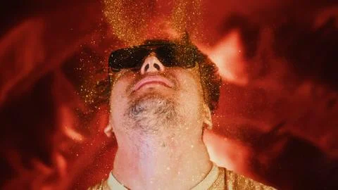 Crazy fun positive face man in gold glitter. Comical photo shake head funny Stock Photos