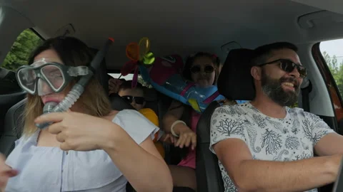 Crazy funny family with children traveling in the car Stock Footage 156499312