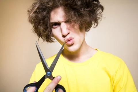 Crazy, funny guy with scissors Stock Photos