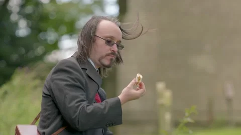 Crazy Funny Man Eats Peanut Butter and Cheese Sandwich In Graveyard Close Up Видео 138672260