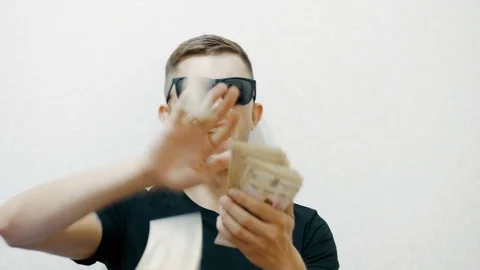Crazy funny man in sunglasses throws money, luxurious life Stock Footage 111962073