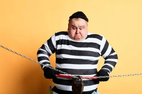 Crazy funny thief using a tool to break the lock Stock Photos