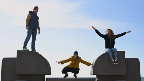 Crazy funny uncoordinated three  people dancing outdoor Stock Footage 105438259