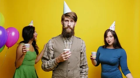 Crazy geek man dancing with beautiful women slow motion party photo booth slow Stock Footage 82068990