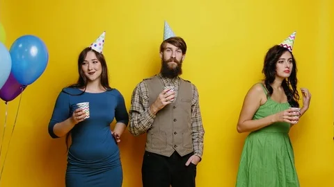 Crazy geek man dancing with beautiful women slow motion party photo booth slow Stock-Footage 82070517